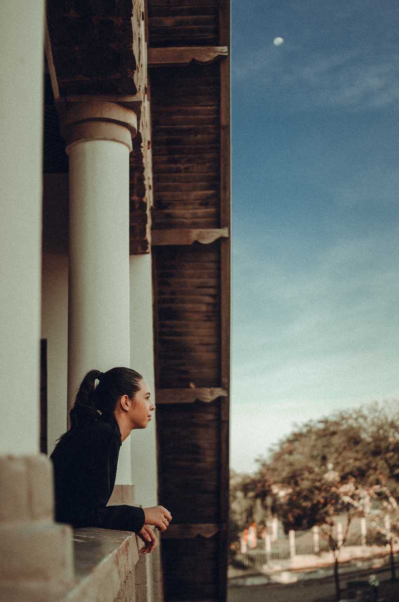 Woman looking out window