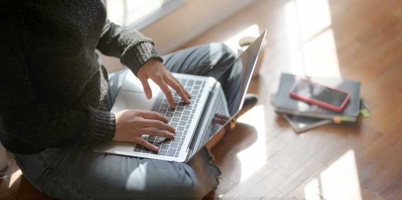 Woman looking at laptop