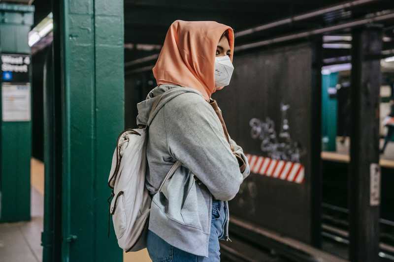 Woman in mask at subway