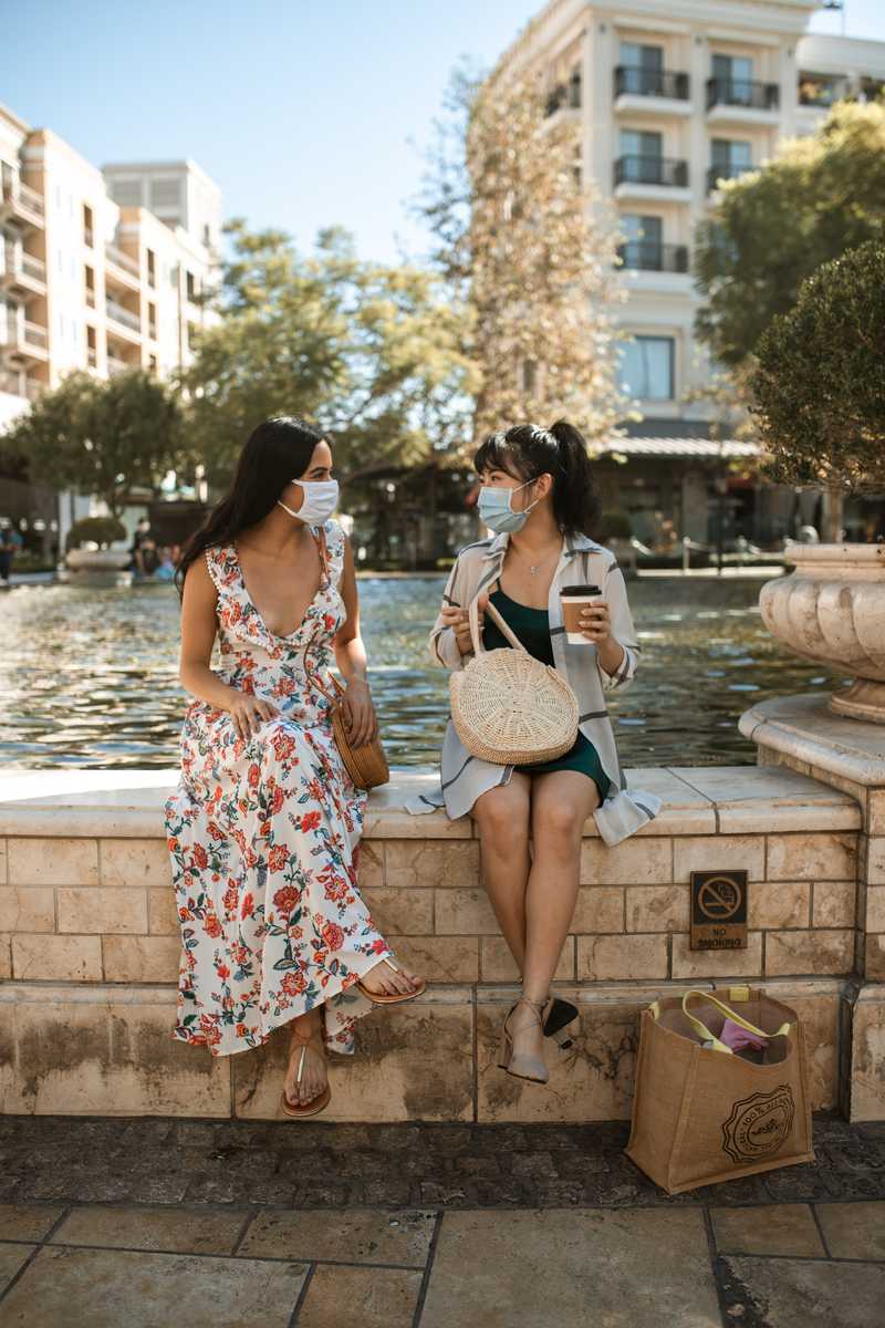 Women sitting at fountain